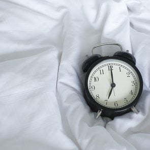 worst time of day to have sex - clock on bed