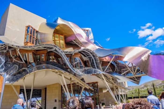 Elciego, Álava, Spain. April 23, 2018: Front view of a modern building with wavy aluminum structures designed by the architect Frank O. Gehry, for the Rioja wine cellars called Marqués de Riscal