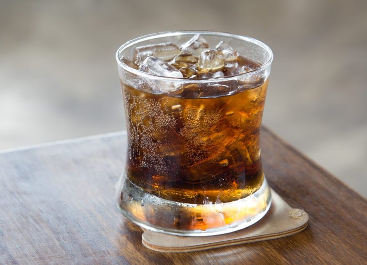 A glass of cola with ice for Cool off in the summer.