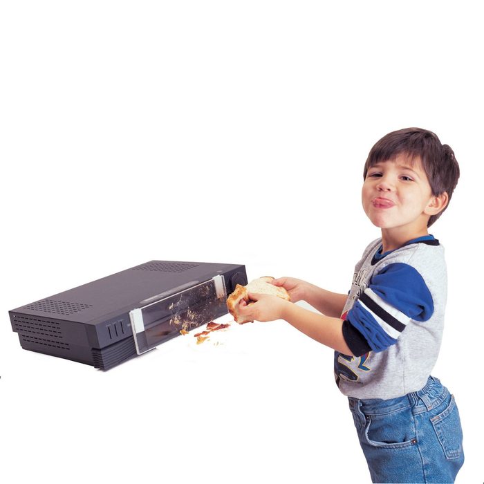 Little kid with his VCR player