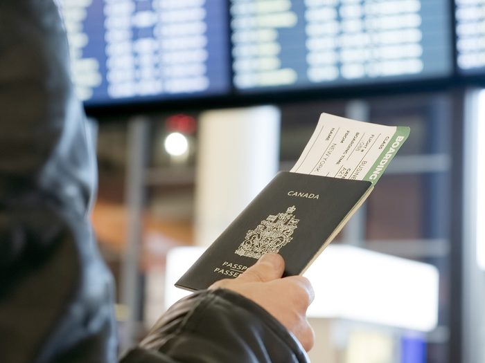 Booking vacation online - Canadian passport at the airport