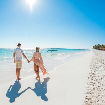 Mistakes to avoid when booking travel online - Couple on Caribbean beach