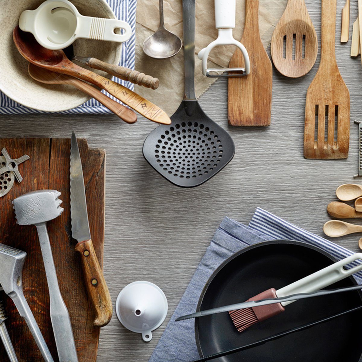 Various kitchen utensils on wooden table