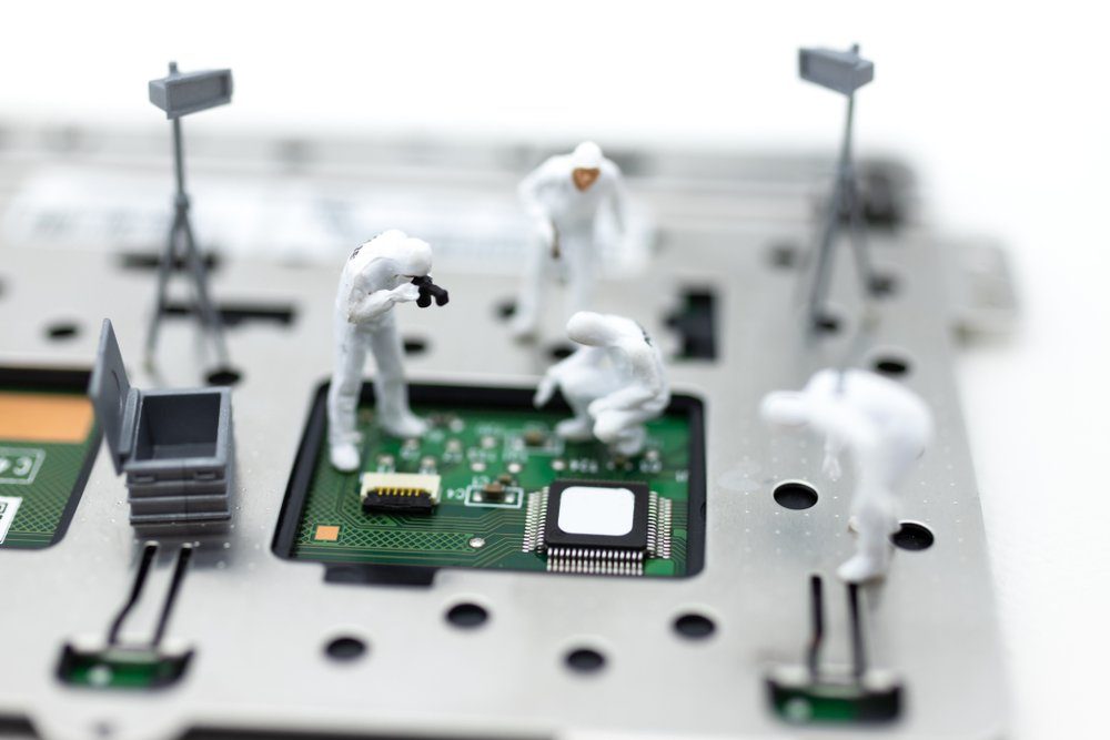 Miniature people: Workers repairing circuit board ,electronics repair. Use image for support and maintenance business.