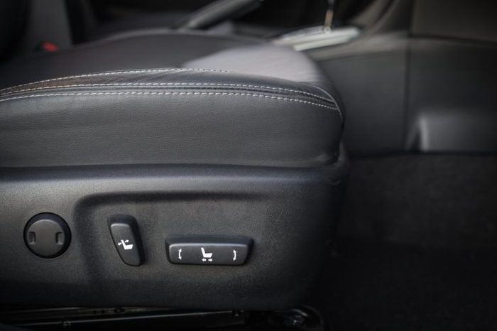 Detail of new modern car interior, Focus on seat adjust switch