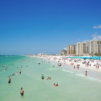 People enjoying water and beach and skyline in Clearwater Beach Florida, Spring Break, April 23, 2017
