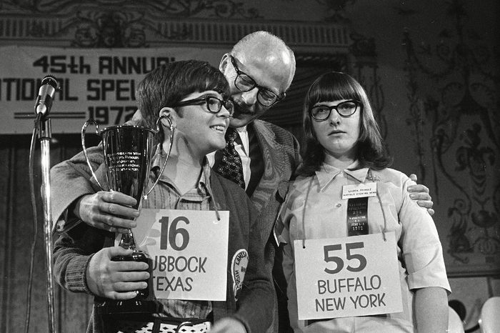 SPELLING BEE Robin Kral, 14, of Lubbock, Texas, left, holds his trophy after winning the 1972 National Spelling Bee in Washington. He out-spelled Lauren Pringle, 13, right, of Buffalo, N.Y., to win the title