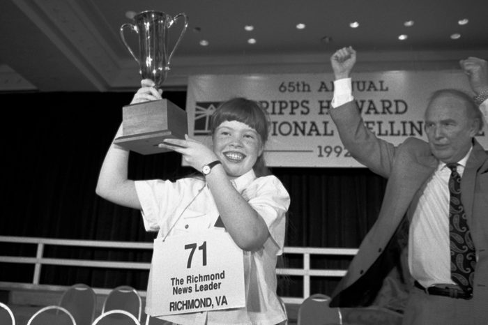 Amanda Goad, Dan Thomasson Amanda Goad, 13, of Richmond, Va., holds up her trophy after spelling "lyceum" correctly to win the 65th annual National Spelling Bee in Washington, D.C., . Dan Thomasson, vice president of Scripps-Howard celebrates at right
