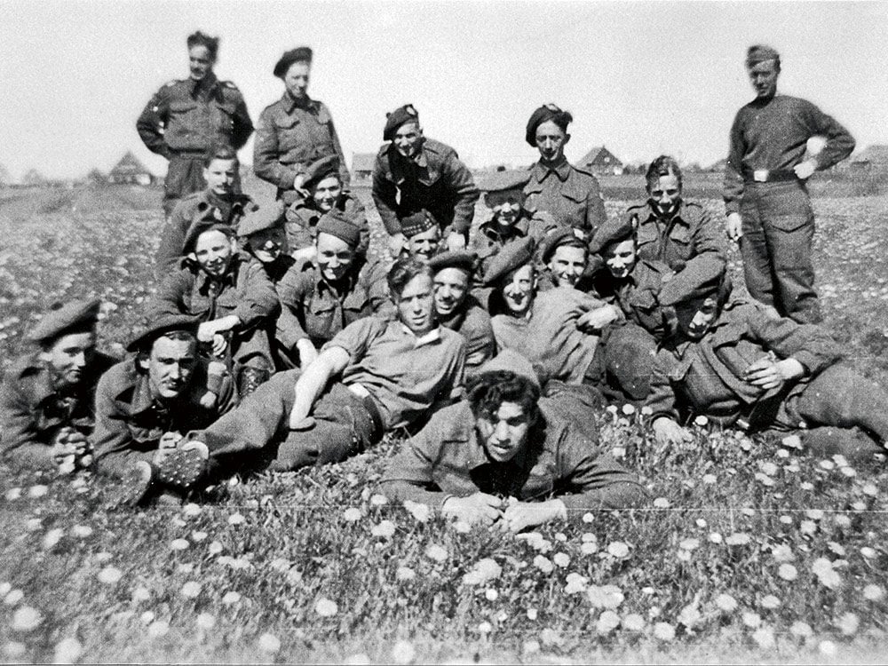 Gibbons—second from left, with moustache—lying with his regiment. 1944