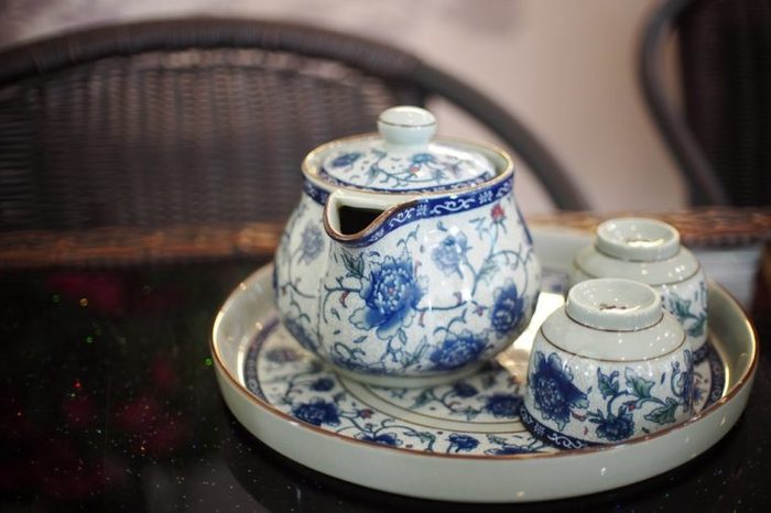 beautiful old vintage retro style porcelain ceramics bone china tableware luxury tea set with golden colour rim on round dish for asian style tea time 