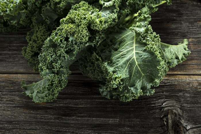 Foods everyone over 50 should be eating - Organic kale with water droplets in closeup