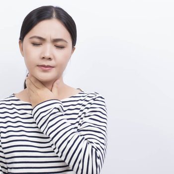 Mono symptoms - Woman has sore throat