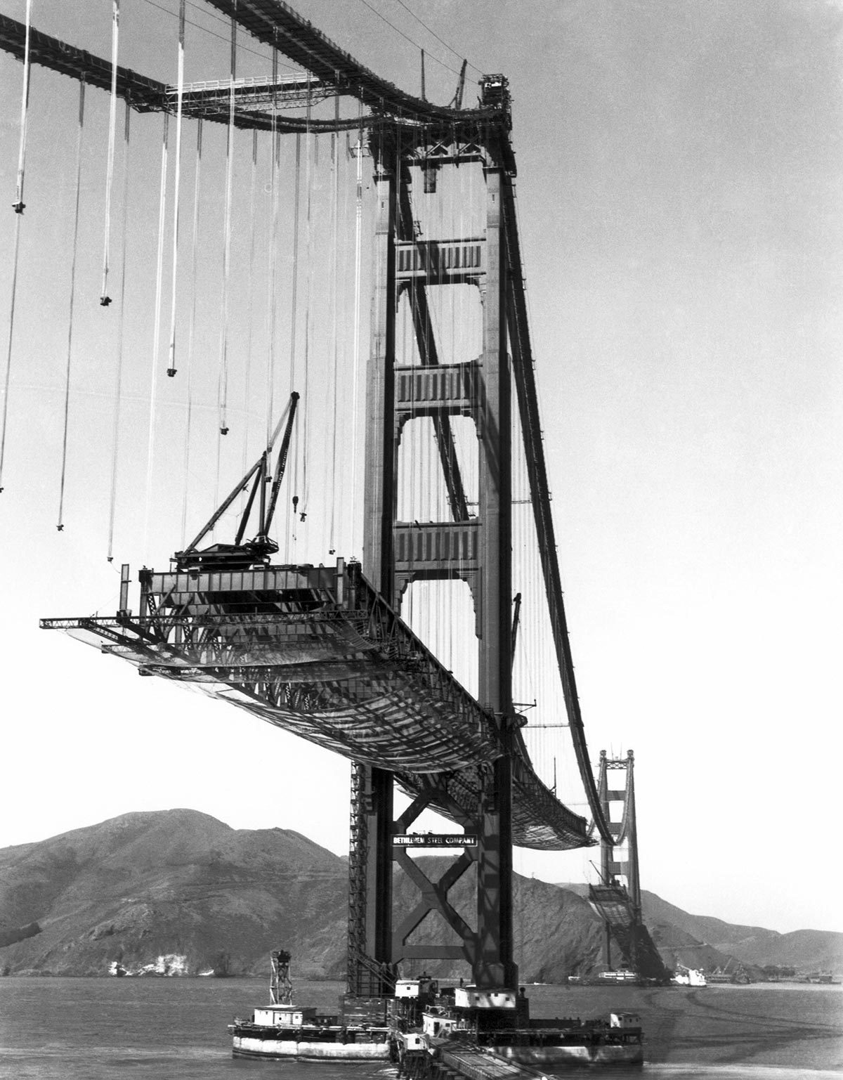 VARIOUS San Francisco, California: October 16, 1936. The Golden Gate Bridge under construction, with the roadbed being suspended from the cables.