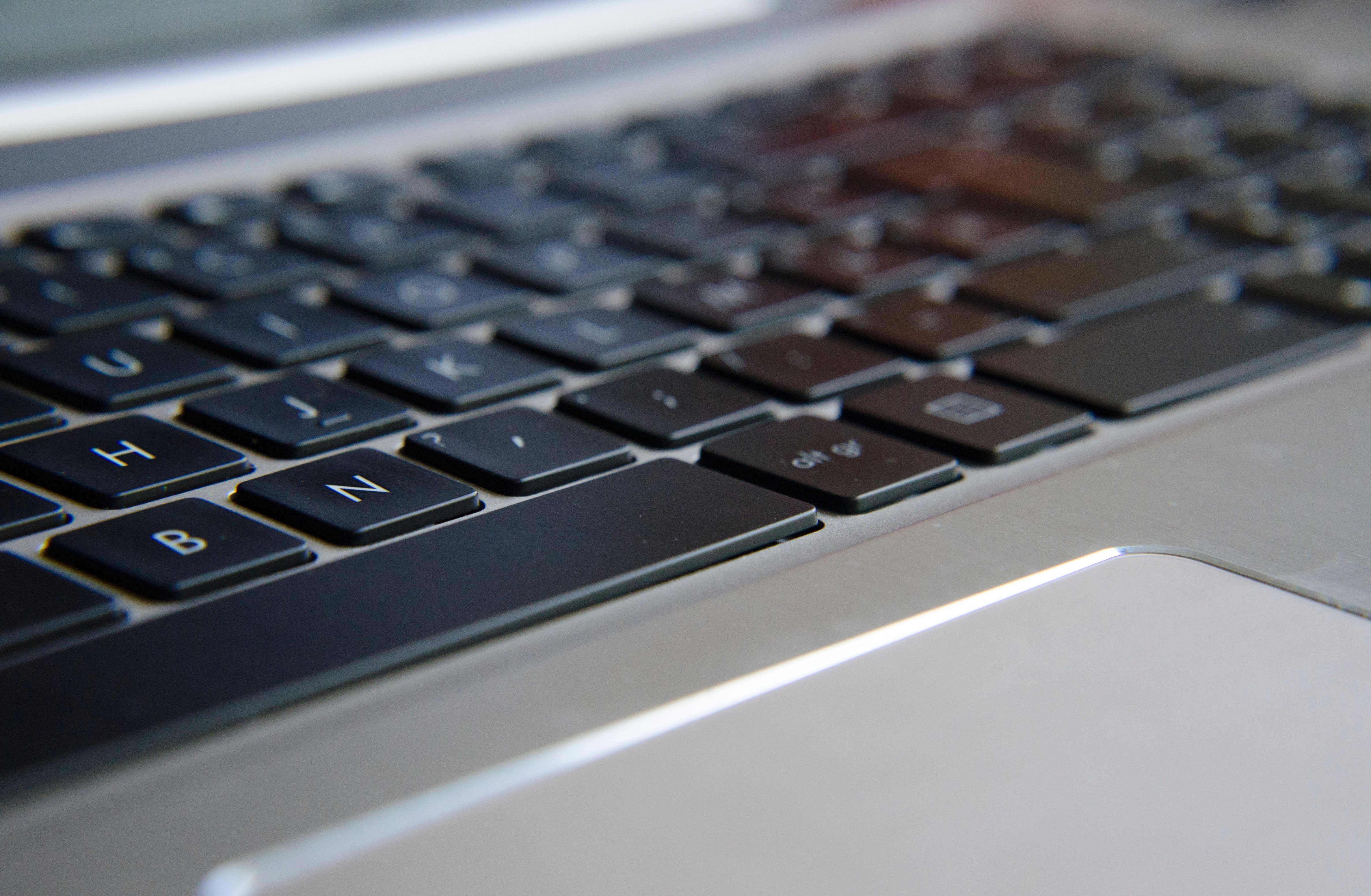 macro photo photography of laptop keyboard in detail with bokeh effect