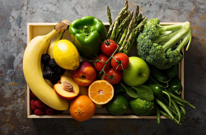 How to live to 100 - Fresh and colorful vegetables and fruits in a wooden crate