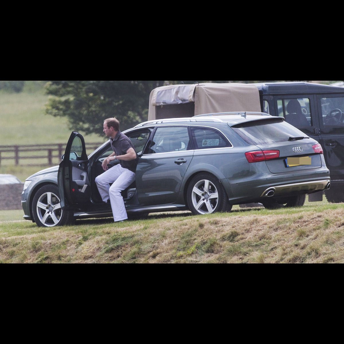 Prince William gets out of Prince Charles' Audi wagon in the country