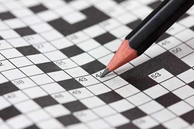 crossword puzzle and pencil