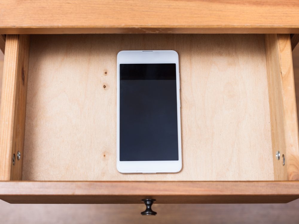 Smartphone in desk drawer