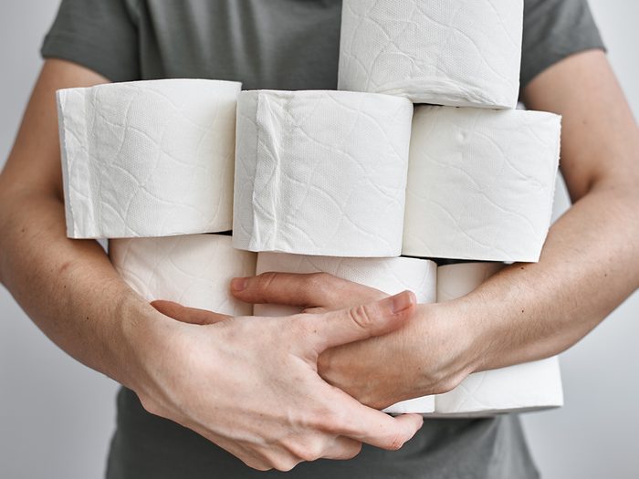 what your poop says about your health - arms full of toilet paper