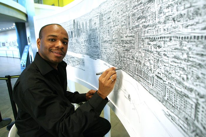 Artist Stephen Wiltshire sketching a panorama of London from memory