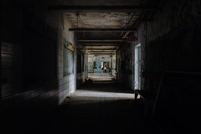 Abandoned, creepy hallway at Creedmoor State Hospital's Building 70 in Queens, New York City, New York.