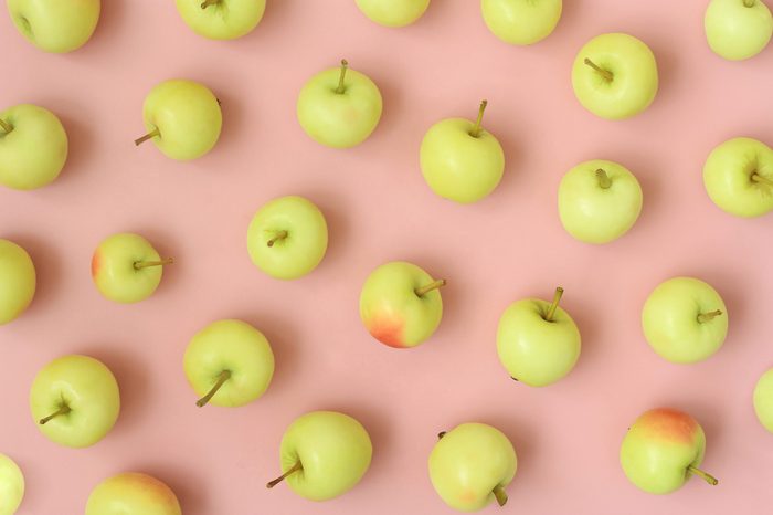 Apples on pink pastel background. Autumn, fall season. Top view, flat lay