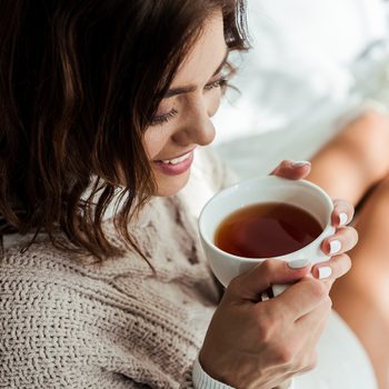 Health benefits of tea - woman drinking tea
