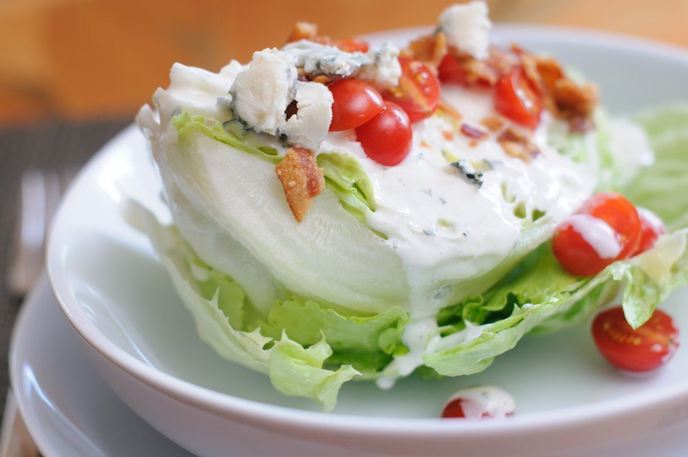 Tasty Iceberg Lettuce Wedge, Topped with Tomatoes, Blue Cheese and Bacon