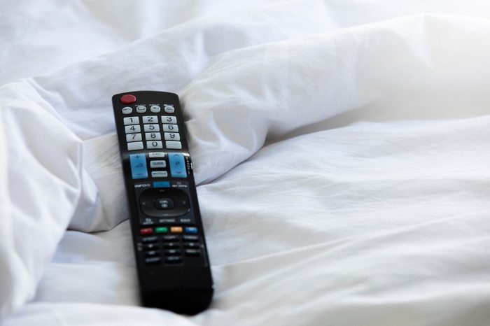 Remote control,Remote control on the bed,Remote control and blanket