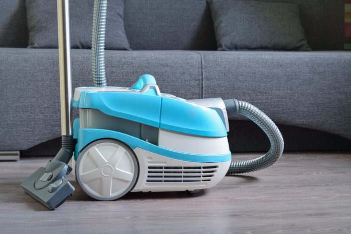 Multifunctional vacuum cleaner on the laminate floor.