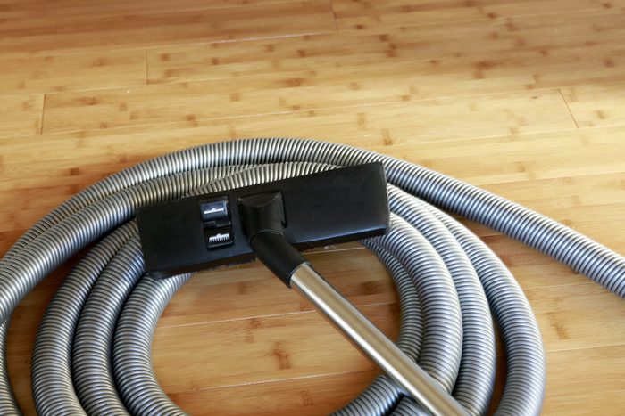 Beautiful bamboo hardwood floor with a central vacuum cleaner 