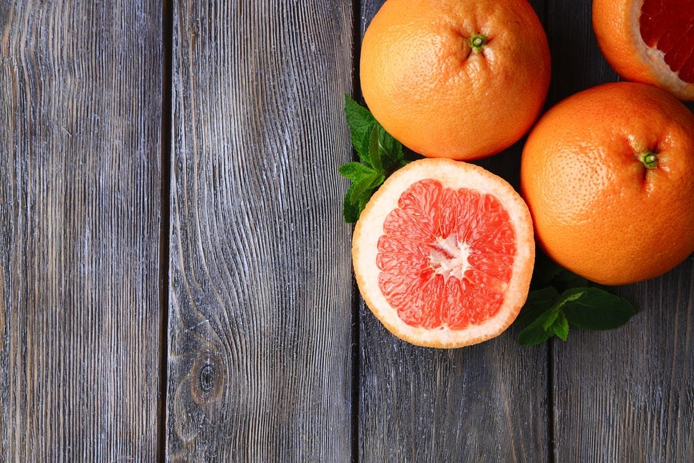 foods that prevent cancer - Ripe grapefruits on wooden background
