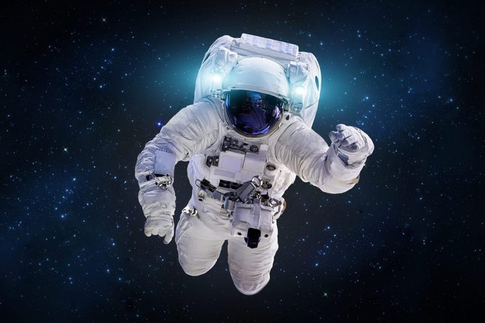 Astronaut in outer space in the deep galaxy. Science theme. Elements of this image furnished by NASA.