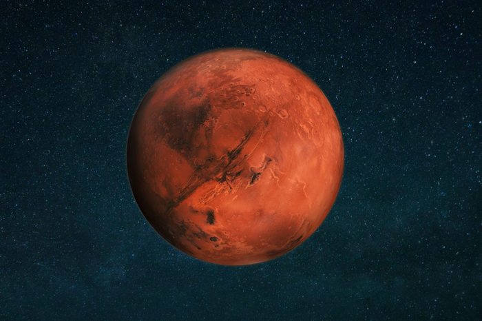 Planet Mars in the starry sky. Red planet in space