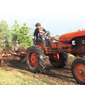 For the love of farming - father and son on tractor