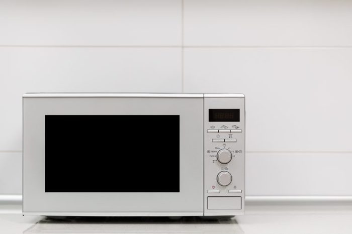 Modern kitchen interior. Kitchen interior with gas stove and microwave oven close up