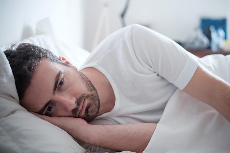 Man lying in bed on his side