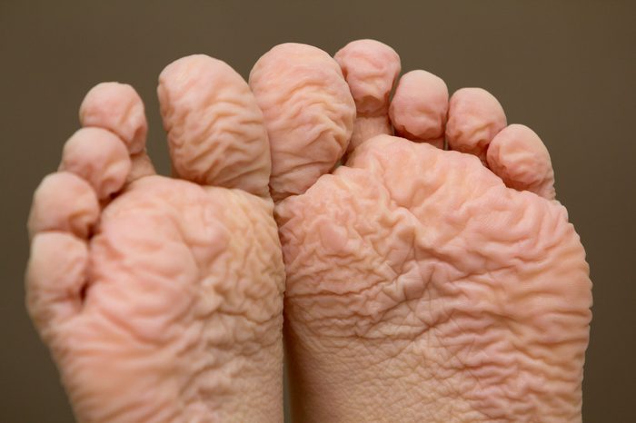 Close-up of children wrinkled feet after long bath