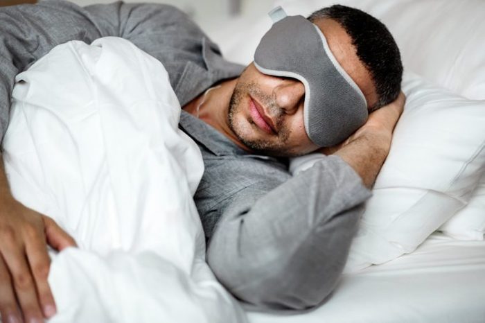 man sleeping bed eye sleep mask