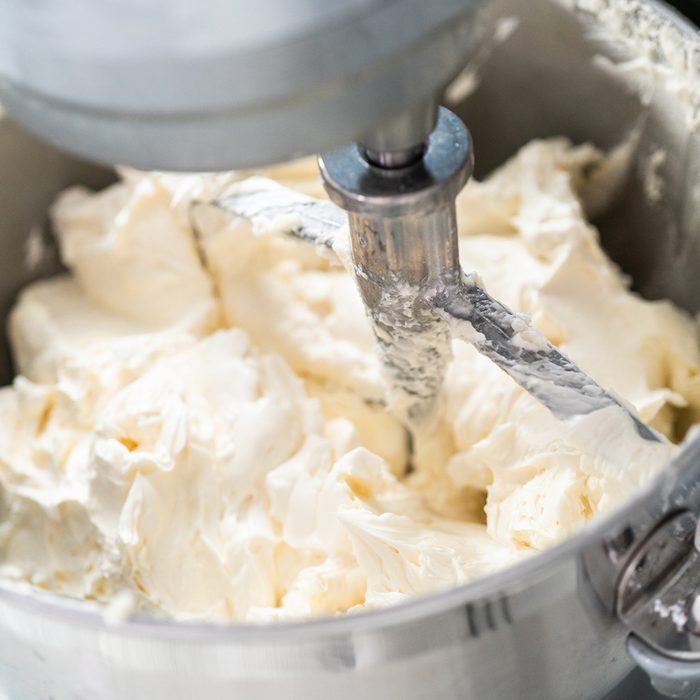 cake baking tips - Making buttercream frosting for decorating a vanilla cake.; Shutterstock ID 1503169313; Job (TFH, TOH, RD, BNB, CWM, CM): TOH
