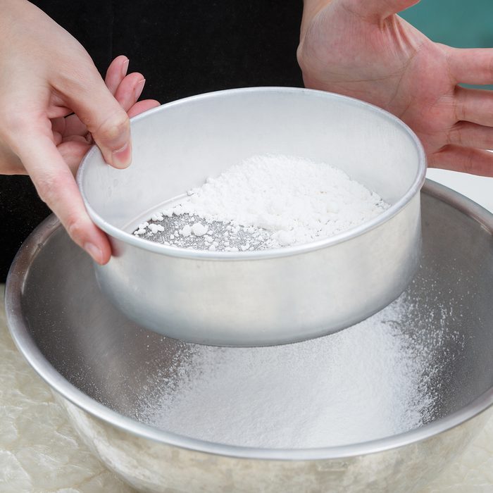sifting flour with flour filter; Shutterstock ID 214900843; Job (TFH, TOH, RD, BNB, CWM, CM): TOH