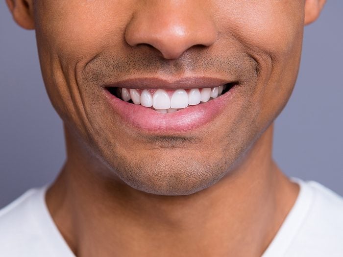 Signs of disease your teeth can reveal - man smiling with nice teeth
