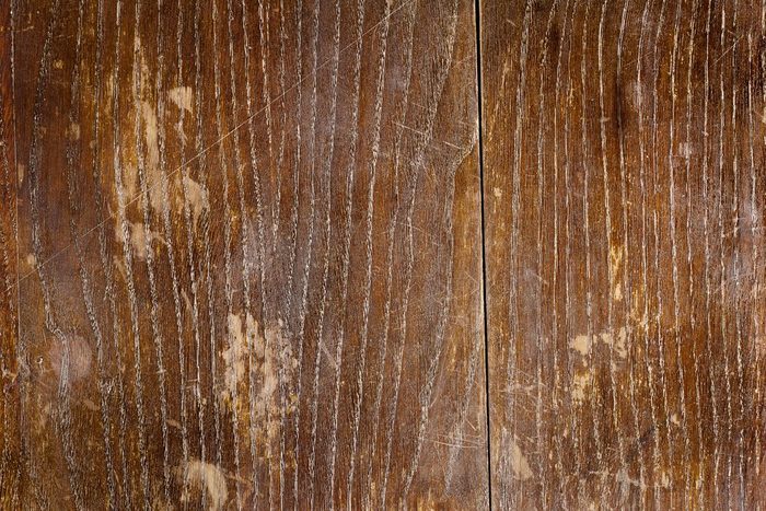 Old scratched oak table top texture background