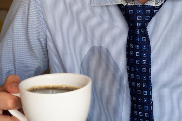The man spilled his coffee on himself.