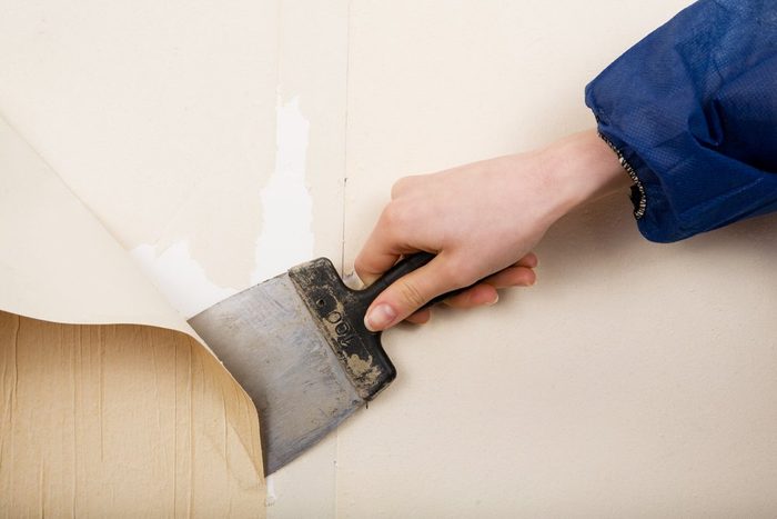 removal of old wallpapers with spatula