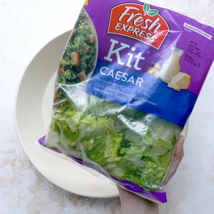 genius holiday tips - Salad kit over empty bowl