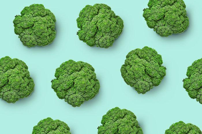 Broccoli cabbage on a colored background. Pattern of fresh broccoli cabbage. Top view of broccoli. Isolated