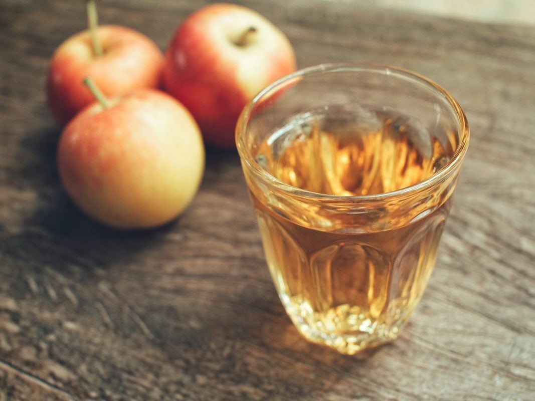 Apple cider vinegar in transparent cup