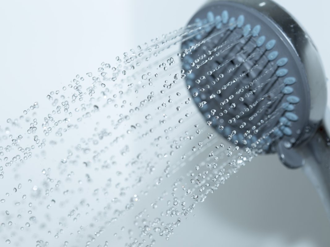 Close-up of shower head pouring water, home remedies for dizziness