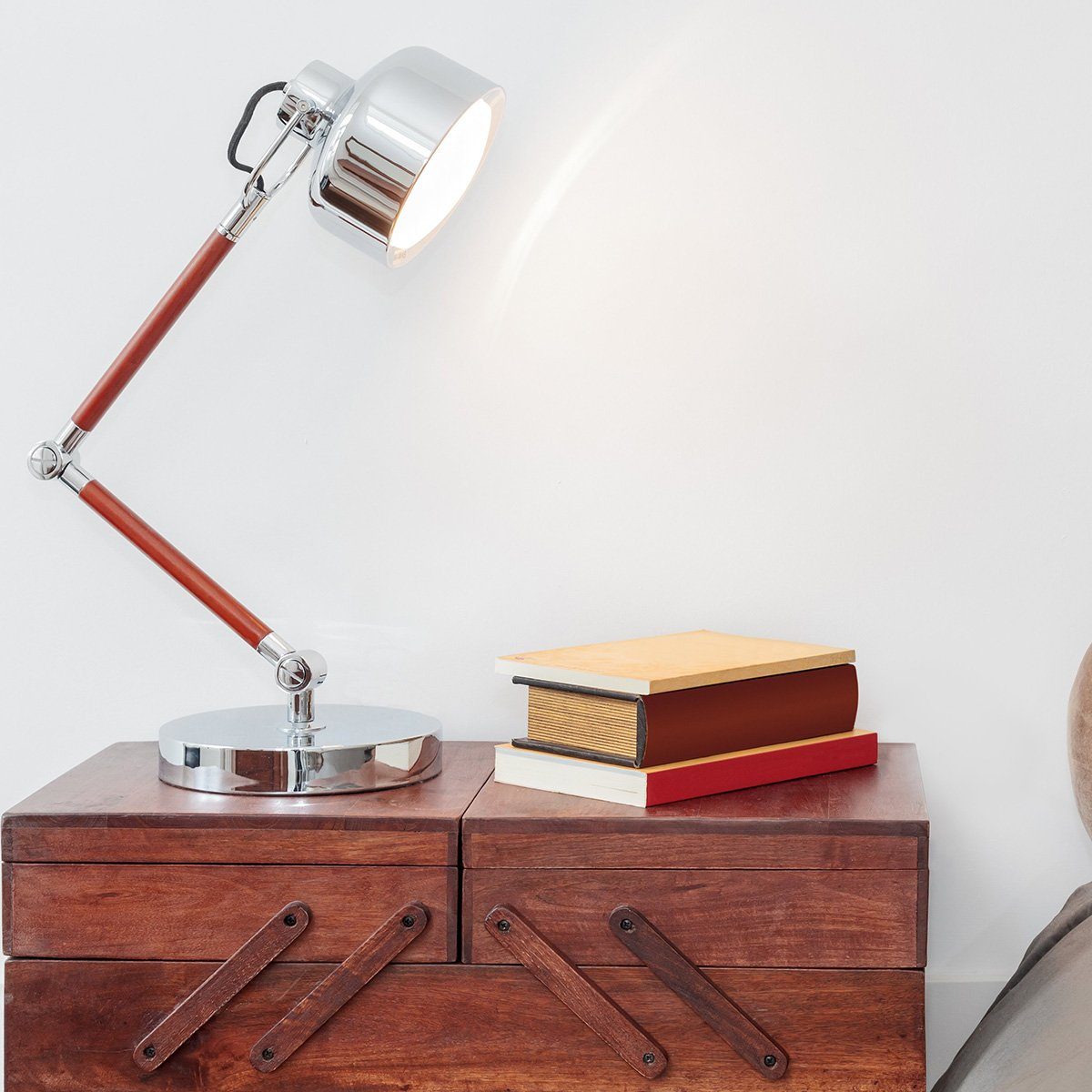 Light and books on a nightstand